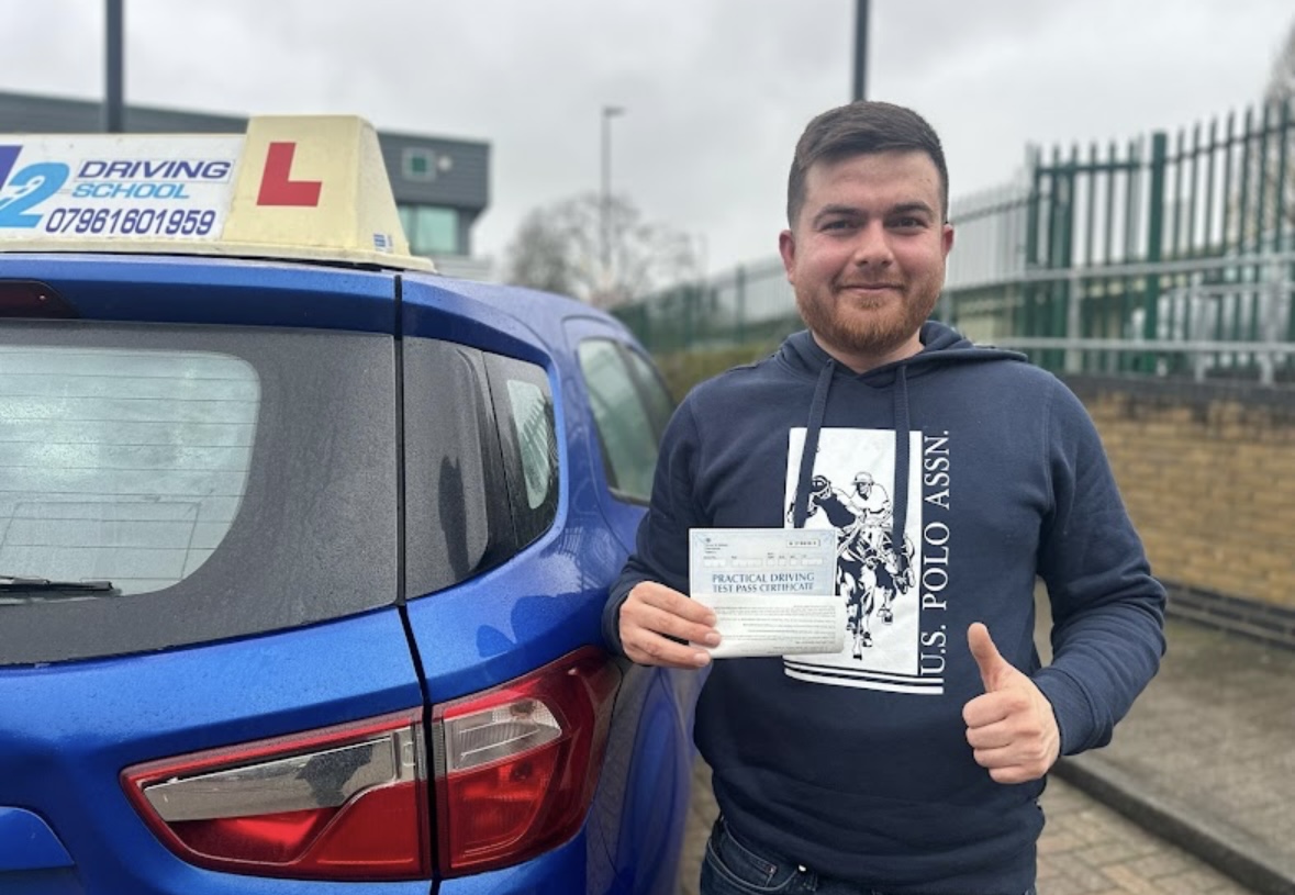 A2 Driving School pupil with their practical driving test pass certificate